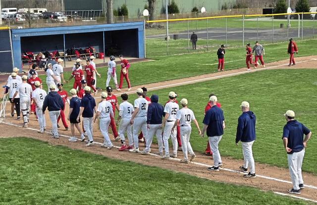 Penn Hills and Franklin Regional baseball players go through the handshake line after Wednesdays baseball game at Haymaker Park in Murrysville. (Bill Beckner Jr. | TribLive)