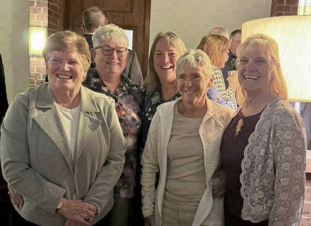 Carol Perroz, in front at right, celebrates her induction into the USA Softball of Pennsylvania Hall of Fame with several of her former Lakerettes teammates at a ceremony March 7, 2026. With Perroz, in front, from left, are Sue Ilyes (second base) and Sis Woods (second base). In back, are Jody Trimmer (outfield) and Ella Ebaugh (pitcher, designated hitter). (Submitted)