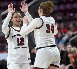 Greensburg Central’s Jayla Peterson celebrates with Nolan Althof in the final seconds against Holy Redeemer during the PIAA Class 3A state championship game on Thursday, Mar. 19, 2026, at Giant Center in Hershey. (Christopher Horner | TribLive)