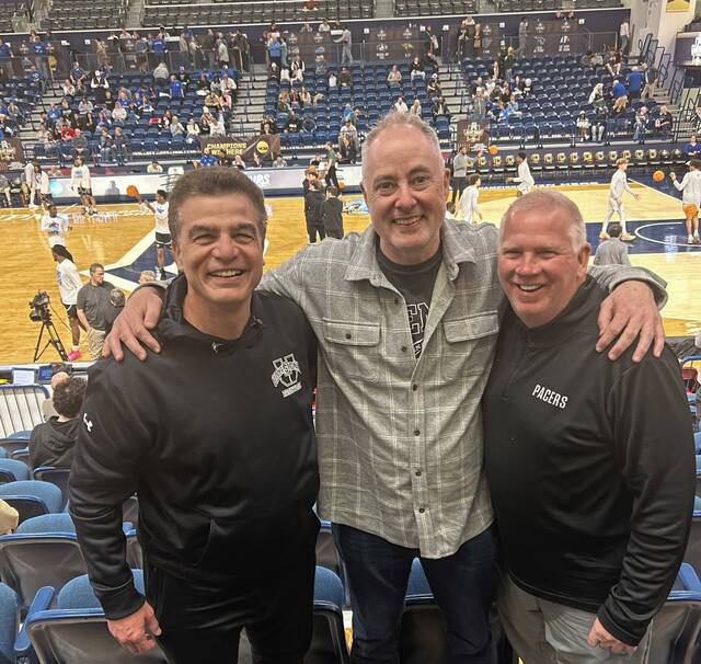Danny Holzer (left) and Tim McConnell (right) pose with Trib columnist Joe Starkey at the NCAA Division II quarterfinals March 25, 2026, at Duquesnes UPMC Cooper Fieldhouse. (Submitted)