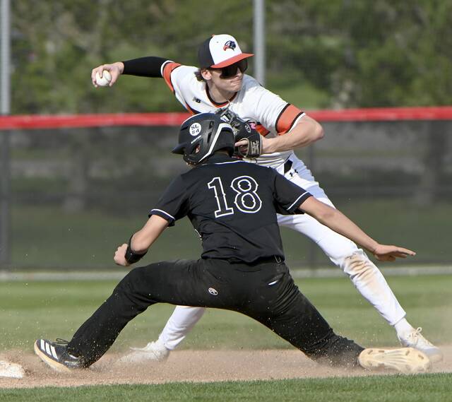 Upper St. Clair’s Brooks York breaks up a double play under Bethel Park’s Chase White during their game on Thursday, Mar. 26, 2026, at Boyce Mayview Park in USC. (Christopher Horner | TribLive)