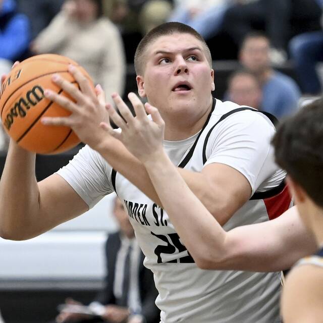 Upper St. Clair’s Ryan Robbins eyes the basket against Norwin on Tuesday, Dec. 9, 2025, at USC. (Christopher Horner | TribLive)