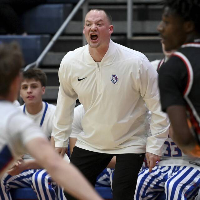 Chartiers Valley coach Corey Dotchin sends a message from the bench against Moon on Dec. 19, 2025. (Christopher Horner | TribLive)