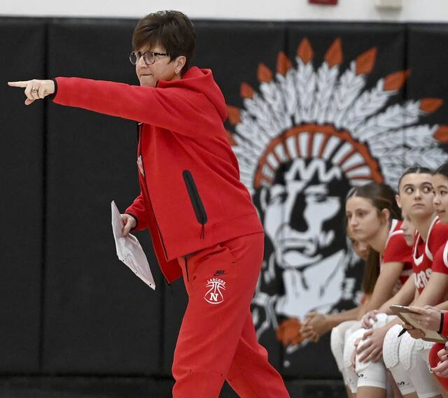 Neshannock coach Luann Grybowski send a message from the bench during the Lancers game on Feb. 4 at Aliquippa. (Christopher Horner | TribLive)