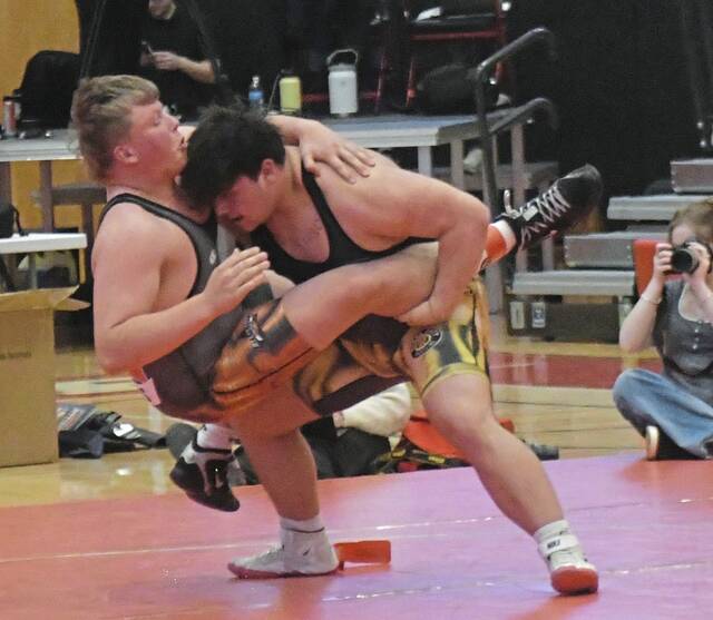 North Allegheny heavyweight Bradyn McConneha takes down Oklahomas Konway Williamson during the Pittsburgh Classic on Saturday. (Paul Schofield | TribLive)