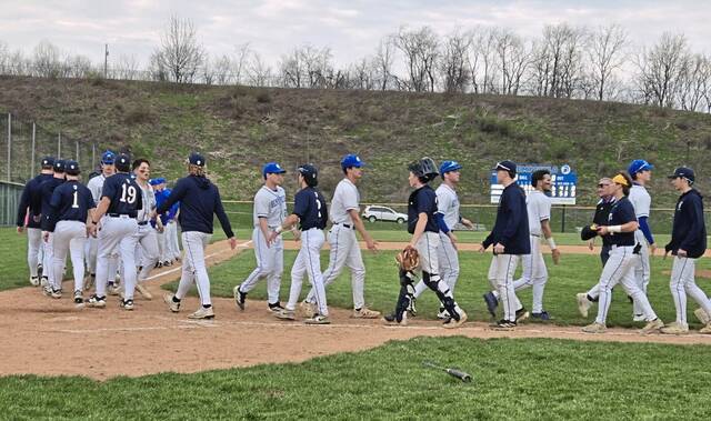Norwin and Hempfield baseball players go through the handshake line Monday after Norwin held on for a 6-5 win in the Section 2-6A opener. (Bill Beckner Jr. | TribLive)