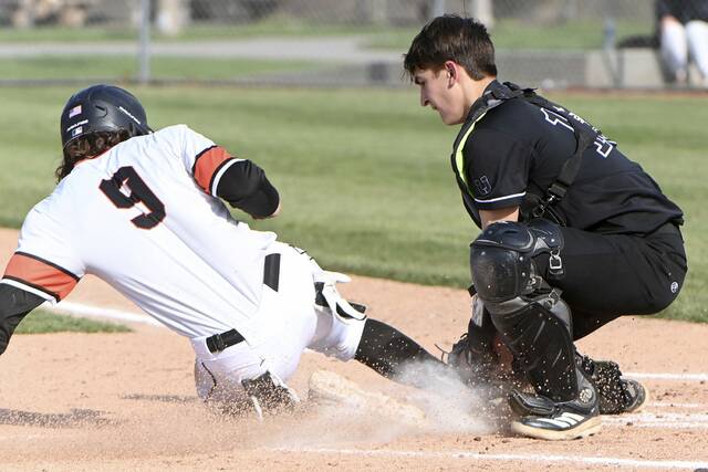 Upper St. Clair catcher Brooks York tags out Bethel Parks Nicholas Rillo at home plate Thursday at Boyce Mayview Park. (Christopher Horner | TribLive)