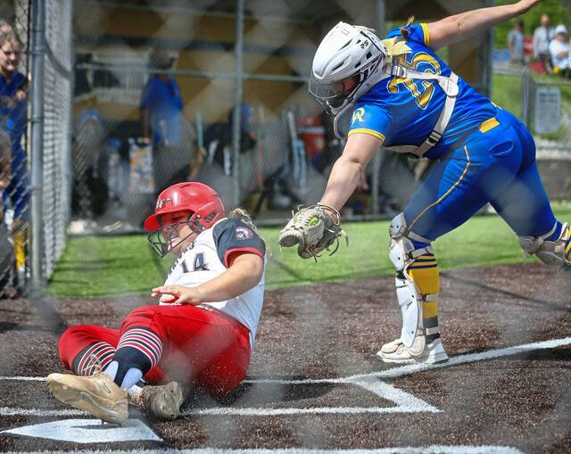 Elizabeth Forwards Addyson Nigut scores, beating a tag from Derrys Sophia Doherty during the WPIAL Class 4A quarterfinals Wednesday, May 14, 2025. (Mike Darnay | Mon Valley Independent)