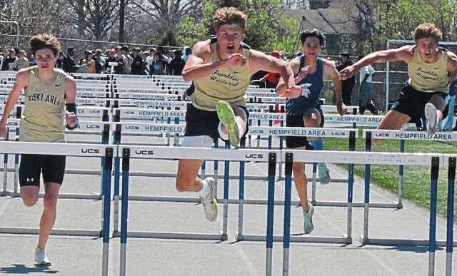 Franklin Regional junior Sean Cartwright wins the 110-meter hurdles at the Lady Spartan/Wildcat meet Saturday. (Paul Schoifield | TribLive)