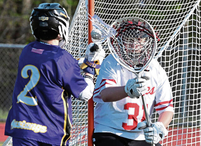 Plums Matthew Amen takes a shot on Avonworth goalie Hunter Graves on Tuesday. (Chaz Palla | TribLive)