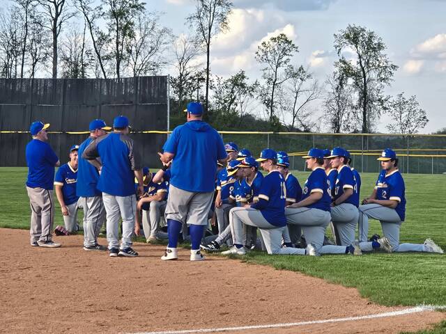 Canon-McMillan players and coaches talk after Thursday's 6-0 win at Hempfield. (Bill Beckner Jr. | TribLive)