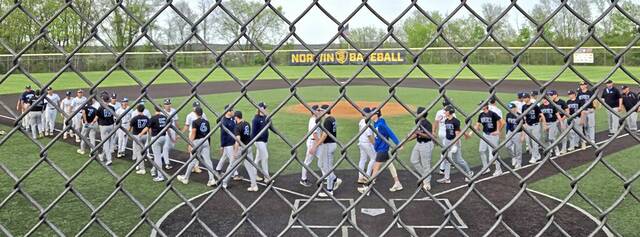 Norwin and Mt. Lebanon players go through the handshake line Monday after Norwin's 11-4 win in North Huntingdon. (Bill Beckner Jr. | TribLive)