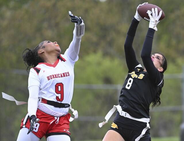 North Alleghenys Bella Devennie pulls in the ball over New Castles Symphany Rice on Thursday at North Allegheny High School. (Chaz Palla | TribLive)