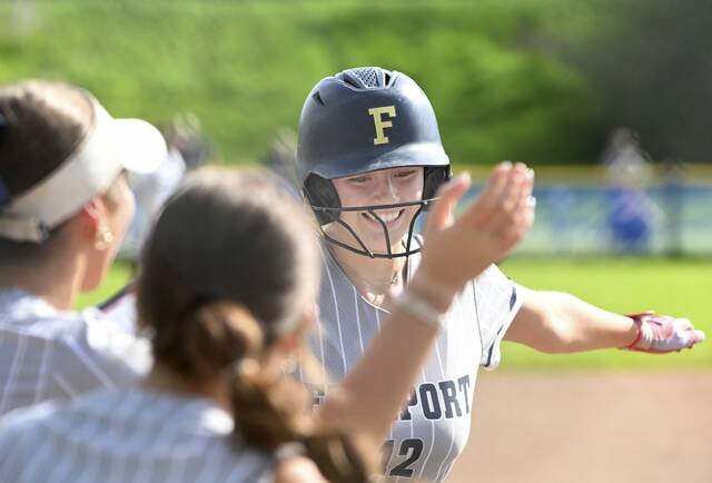 Freeport celebrates with Lauren Clark after Clarks home run against Greensburg Salem on Monday. (Chaz Palla | TribLive)