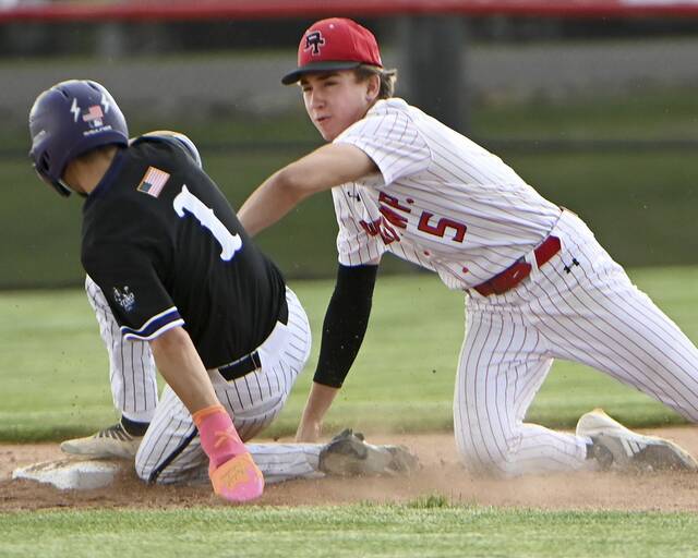 Peters Townships Colin Stofik tags out Baldwins Brady Caplan at second base during a WPIAL Class 5A first-round game May 14, 2025. (Christopher Horner | TribLive)