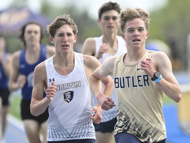 Butlers Brendan Eicher edges Norwins Alexander Barrett in the 1,600-meter run during the WPIAL Class 3A team championships Tuesday. (Chaz Palla | TribLive)