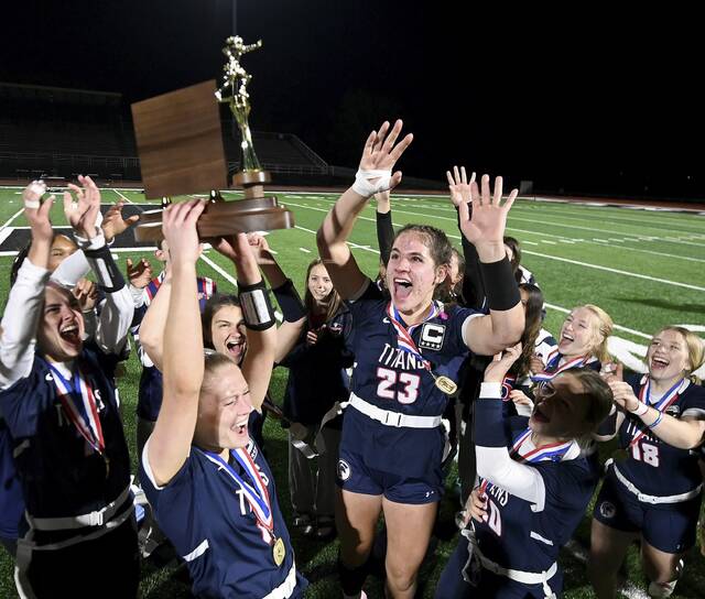 The Shaler Area girls flag football team celebrates with the WPIAL championship trophy after defeating Plum in the final on Thursday, May 7, 2026, at Upper St. Clair. (Christopher Horner | TribLive)