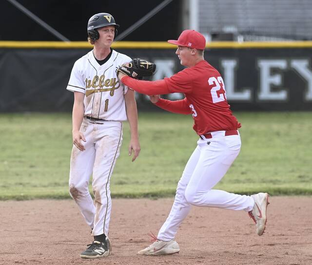 Indiana pitcher Sully VanHoose tags Valley’s Dominick Dunkel during their game on Tuesday, April 28, 2026, at Valley. (Christopher Horner | TribLive)