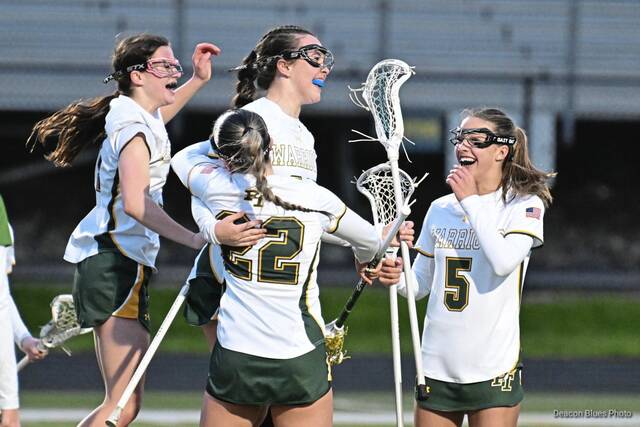 Penn-Traffords Georgia Vislocky (22) celebrates with Avery Bosack after a goal, as Annabelle Aquino (left) and Lillian Hawk (right) look on during the 2026 season. (Deacon Blues Photo)