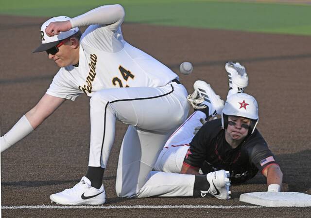 Fraziers Tyler Morrison gets back safely to first base behind Riverviews Jake Sprajcar during a WPIAL Class 2A first-round playoff game Monday at West Mifflin. (Chaz Palla | TribLive)
