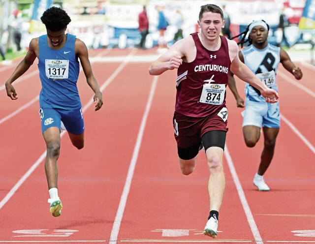 Greenburg Central Catholics Jerry Davis wins the 400-meter run during the 2025 PIAA Class 2A track championships. (Chaz Palla | TribLive)