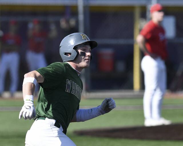 Penn-Traffords Nico Casciato watches his triple against Fox Chapel during their WPIAL Class 5A first-round playoff game Tuesday. (Christopher Horner | TribLive)