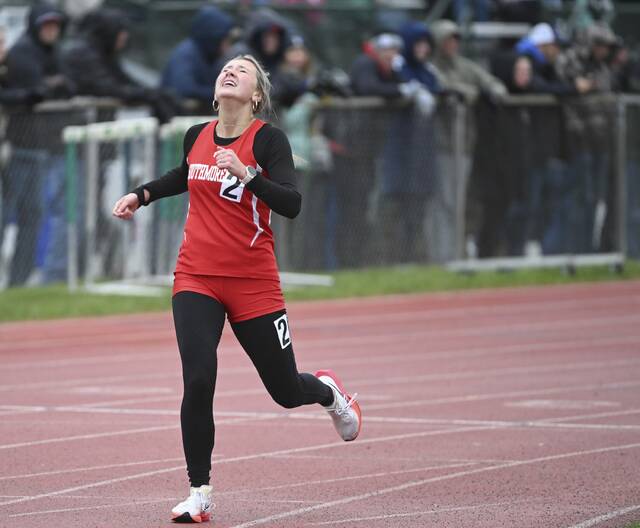Southmorelands Megan Mehall reacts after winning the 1,600-meter run during the WPIAL 2A track and field championships Thursday at Slippery Rock University. (Chaz Palla | TribLive)