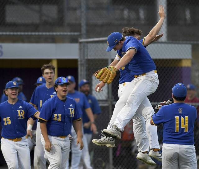 Derry’s Max Doherty celebrates with Noah Stough after defeating Hampton in their WPIAL Class 4A quarterfinal on Monday, May 18, 2026, at Plum. (Christopher Horner | TribLive)
