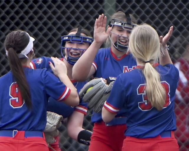Mt. Pleasant pitcher Danica Trainer celebrates with teammates during a win over Deer Lakes on April 1. (Christopher Horner | TribLive)