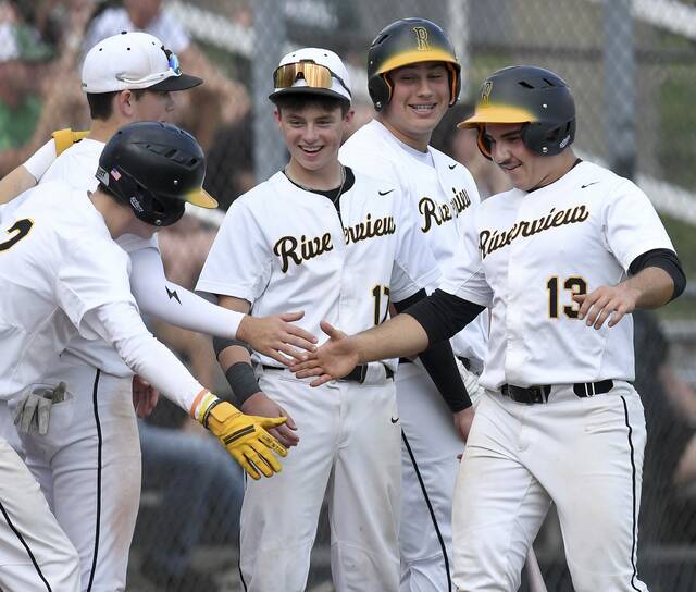 Riverviews Lukas Duncan (13) is greeted by teammates after scoring against Laurel on Monday, May 18, 2026, at NA. (Christopher Horner | TribLive)