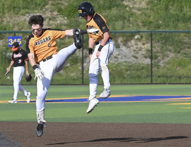 Thomas Jeffersons Andy Brnusak celebrates with Eli Graff after Graffs game-winning RBI to beat Bethel Park during the WPIAL Class 5A quarterfinals Tuesday at West Mifflin. (Chaz Palla | TribLive)
