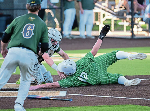 Penn-Trafford catcher Colton Tyburski tags out South Fayettes RJ Borgesi during WPIAL Class 5A playoff action Tuesday at West Mifflin. (Chaz Palla | TribLive)