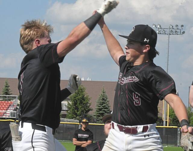 Greensburg Central Catholic catcher Anthony Grippo (left) and teammate Stephen Kochis celebrate Grippos first-inning home run against Jefferson-Morgan on May 18 at Washington & Jeffersons Ross Memorial Park. (Paul Schofield | TribLive)