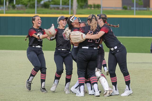 Elizabeth Forward players rush onto the field to celebrate their 7-5 victory over Hampton in a WPIAL Class 4A semifinal Thursday, May 21, 2026, at Gateway. The Warriors advanced to the WPIAL Class 4A championship game with the win. (Jeff Helsel | Mon Valley Independent)