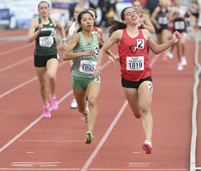 Peters Townships Kathryn Froelich wins the 1,600-meter run during the PIAA Class 3A Track and Field Championships on Friday at Shippensburg. (Chaz Palla | TribLive)
