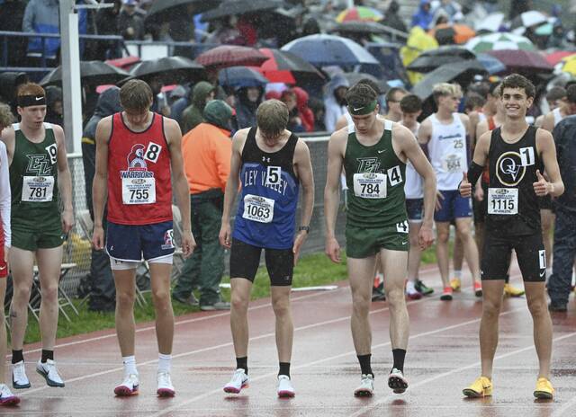 Quaker Valleys Jonah Montagnese gives a thumbs up before winning the 3,200 during the PIAA Class 2A Track and Field Championships on Saturday at Shippensburg University. (Chaz Palla | TribLive)