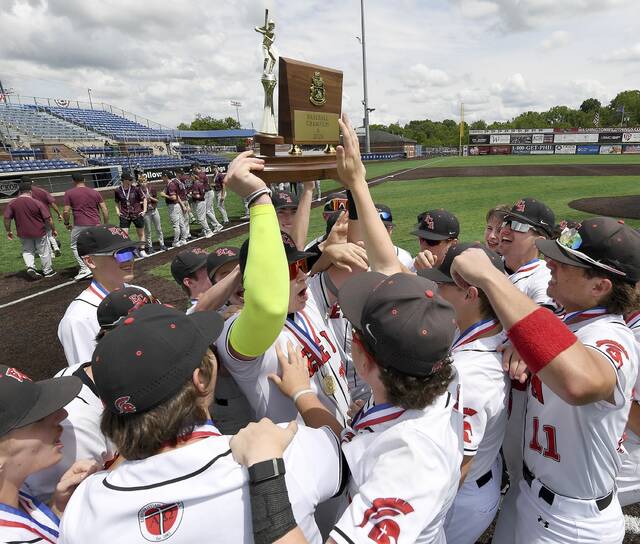 The Eden Christian Academy baseball team celebrates with the WPIAL championship trophy after defeating Greensburg Central in the Class A final on Tuesday, May 26, 2026, at EQT Park. (Christopher Horner | TribLive)