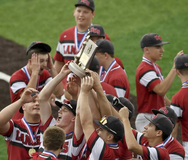 The Neshannock baseball team celebrates with the WPIAL championship trophy after defeating Fort Cherry in the Class 2A final on Tuesday, May 26, 2026, at EQT Park. (Christopher Horner | TribLive)