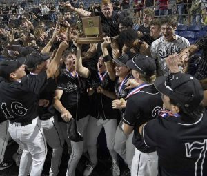 The Upper St. Clair baseball team celebrates with the WPIAL championship trophy after defeating South Fayette in the Class 5A final on Wednesday, May 27, 2026, at EQT Park. (Christopher Horner | TribLive)