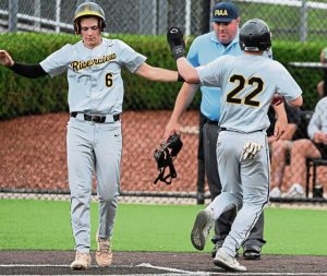Riverviews Rex Roberts celebrates with Owen Orbich after Orbich scores against South Side during the WPIAL Class 2A third-place game Tuesday at Ross Memorial Park. (Chaz Palla | TribLive)